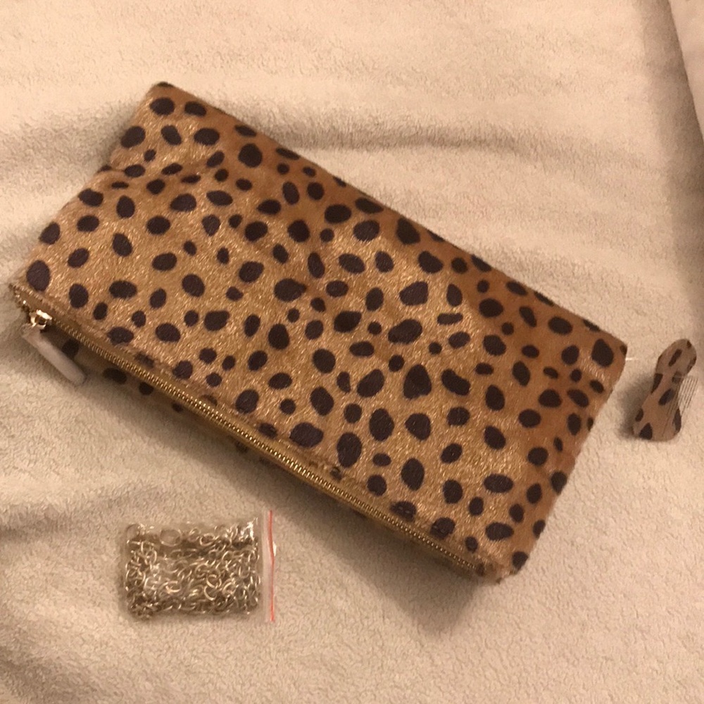 Never worn Leopard fold over clutch